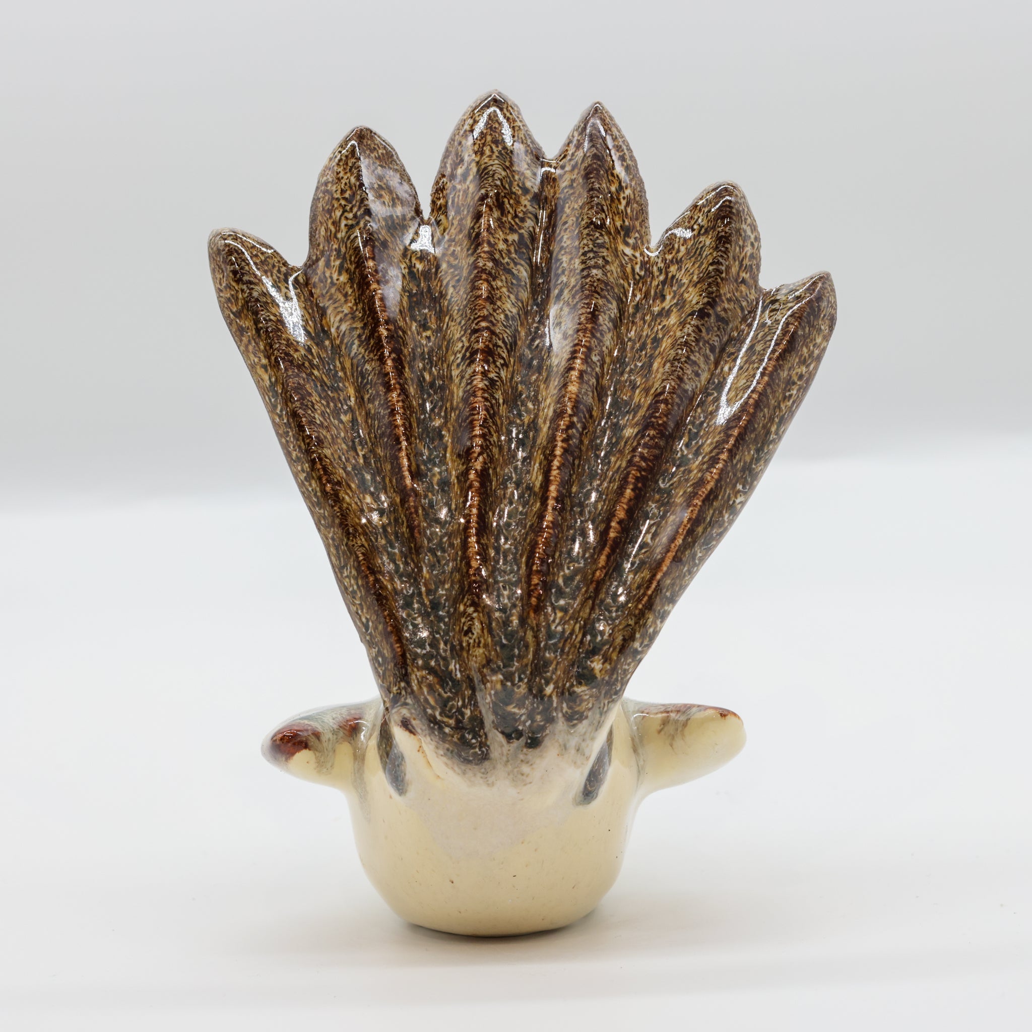 Pīwakawaka ceramic sculpture front view, New Zealand fantail ornament