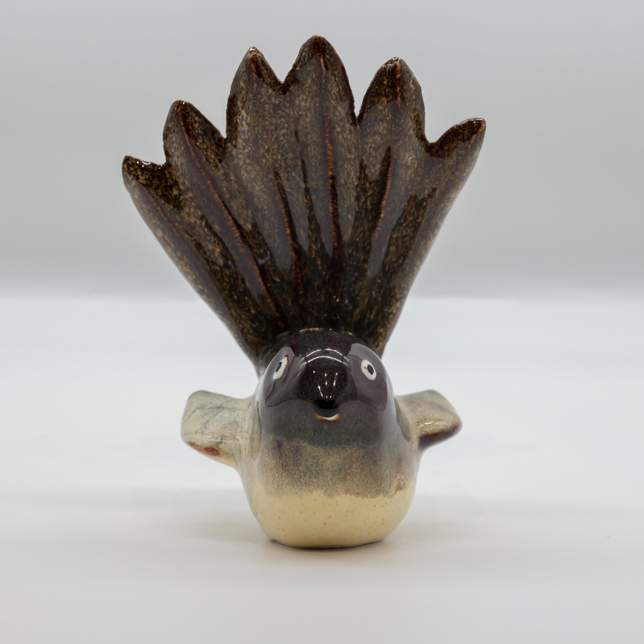 Pīwakawaka ceramic sculpture side profile