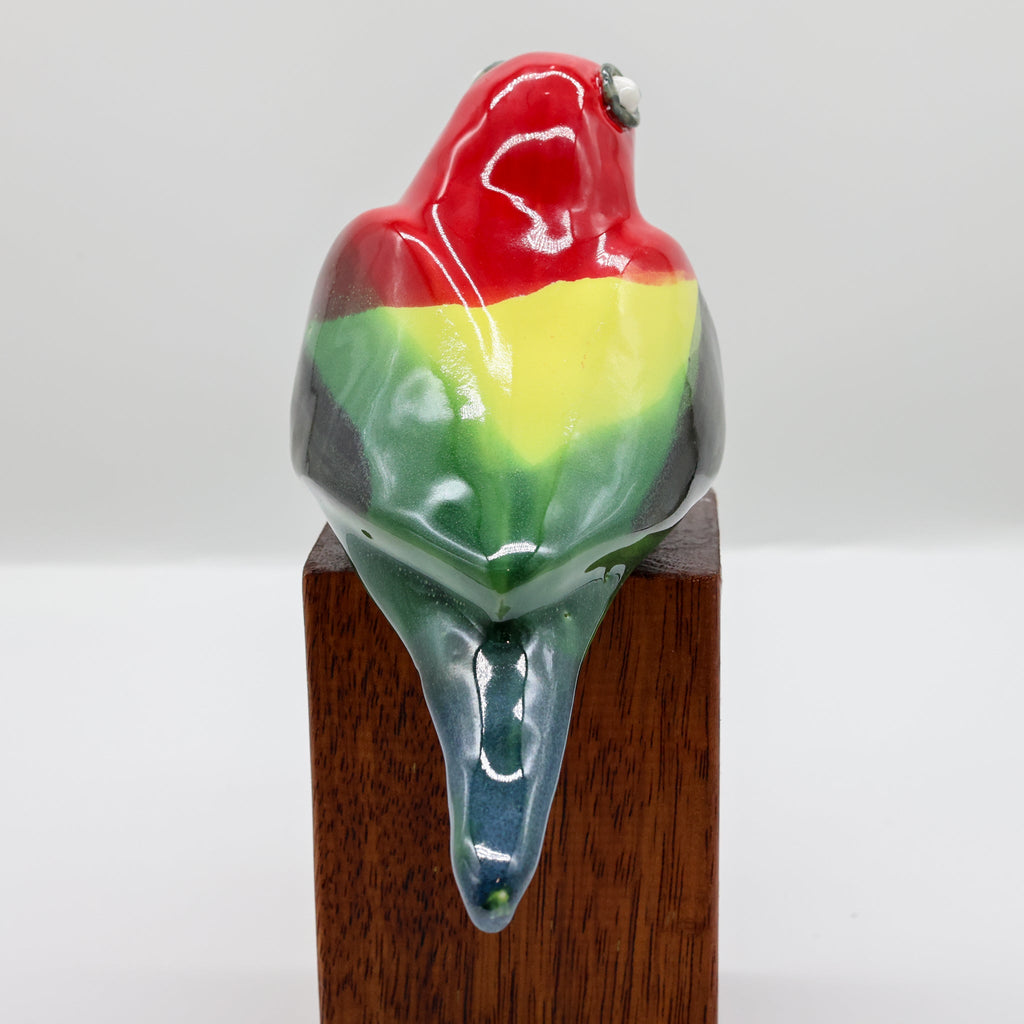 Eastern Rosella ceramic sculpture front view, colourful parrot ornament