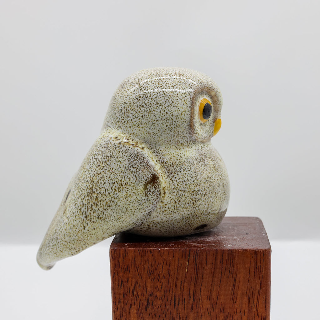 Ruru ceramic sculpture displayed on a wooden surface