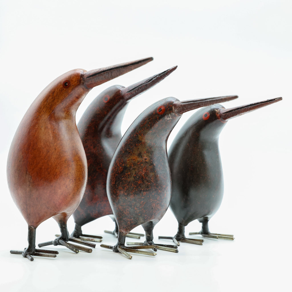 Stone Kiwi sculpture displayed on a wooden surface