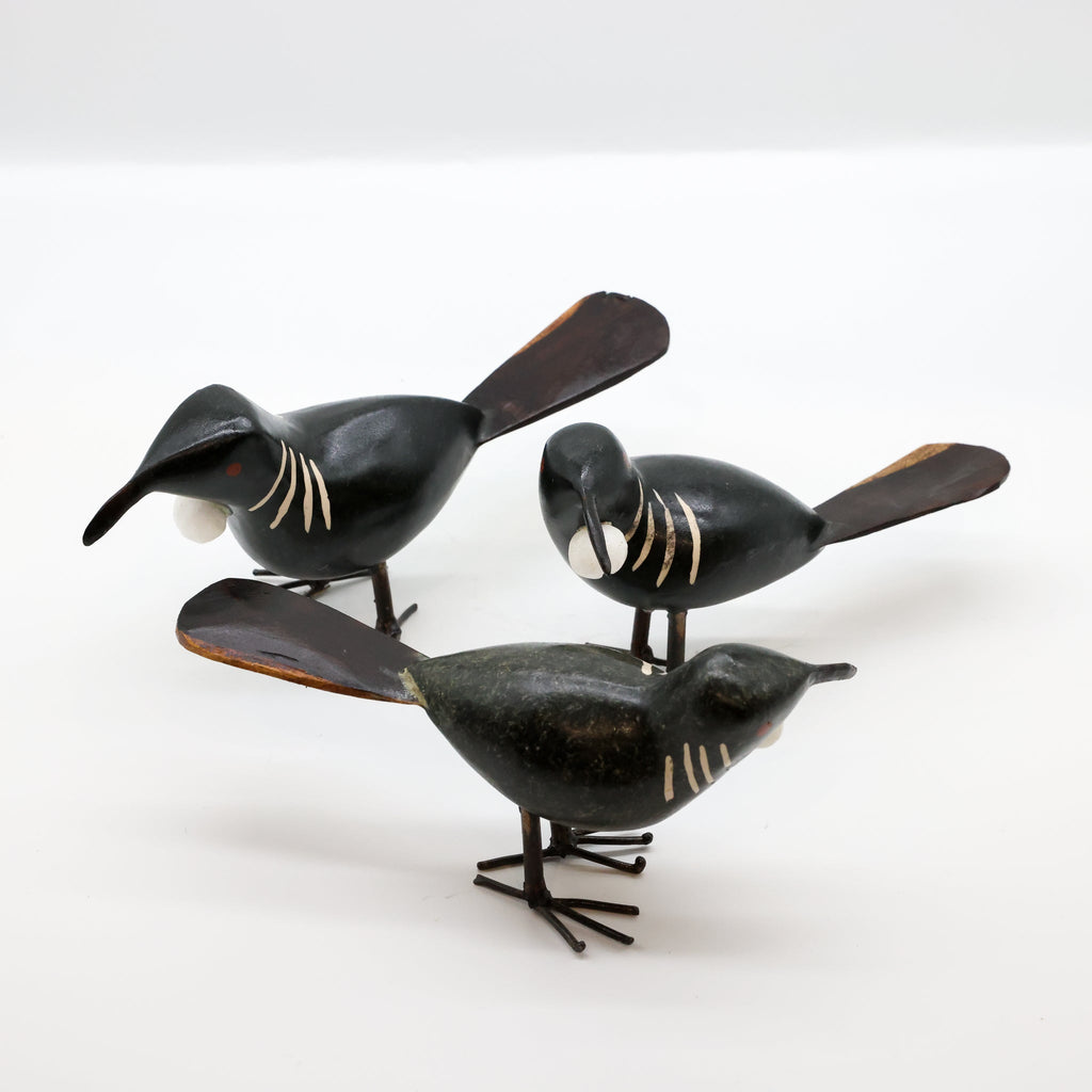 Stone Tūī sculpture detail of recycled metal feet