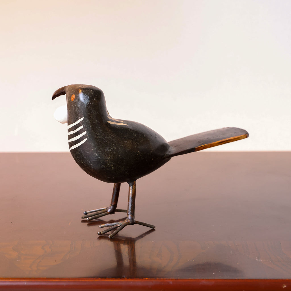 Stone Tūī sculpture detail of white throat pōī