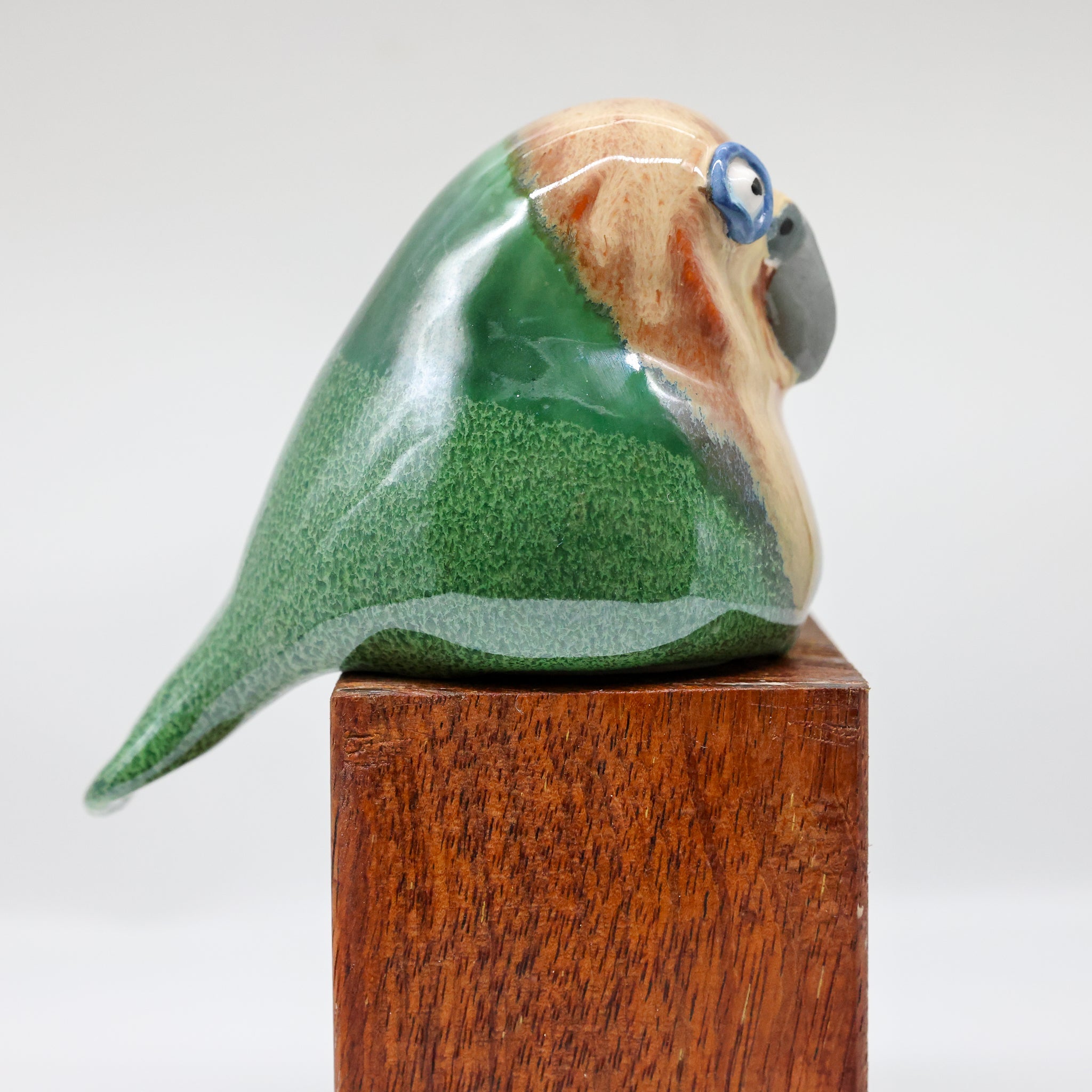 Kākāpō ceramic sculpture, alternate angle showing porcelain glaze